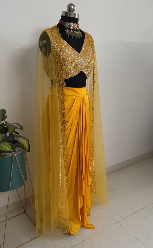 Yellow Drape Skirt Set with Mirror Work Blouse & Cape